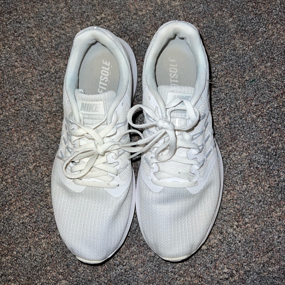 White Nike running shoes